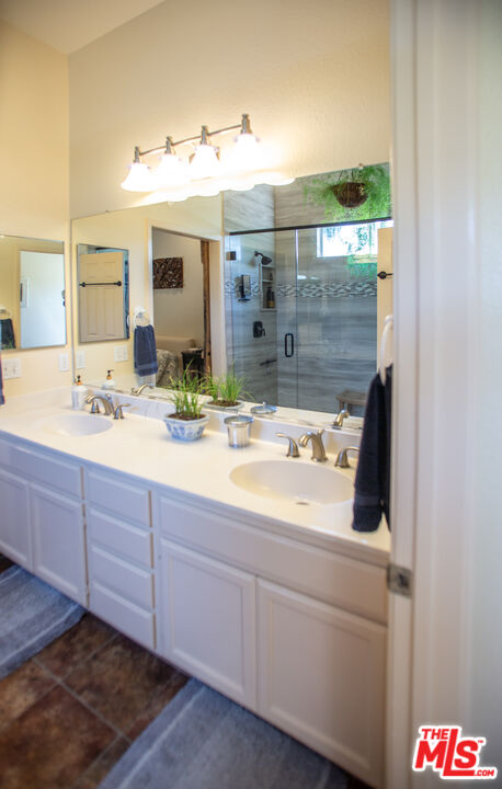969 Vintage Way Los Alamos, CA 93440 - Photo 15 of 59 a bathroom with a sink and a mirror