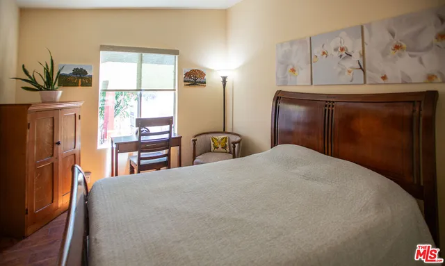 a bathroom with a sink and mirror with toilet