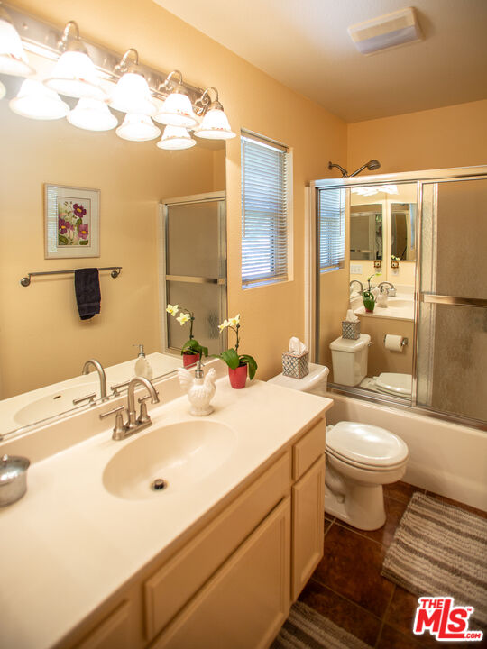 969 Vintage Way Los Alamos, CA 93440 - Photo 19 of 59 a bathroom with a sink and mirror with toilet