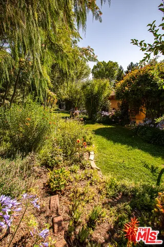 a view of swimming pool with outdoor seating