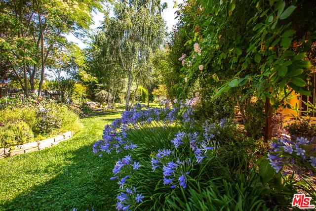a view of a chairs and table in a patio