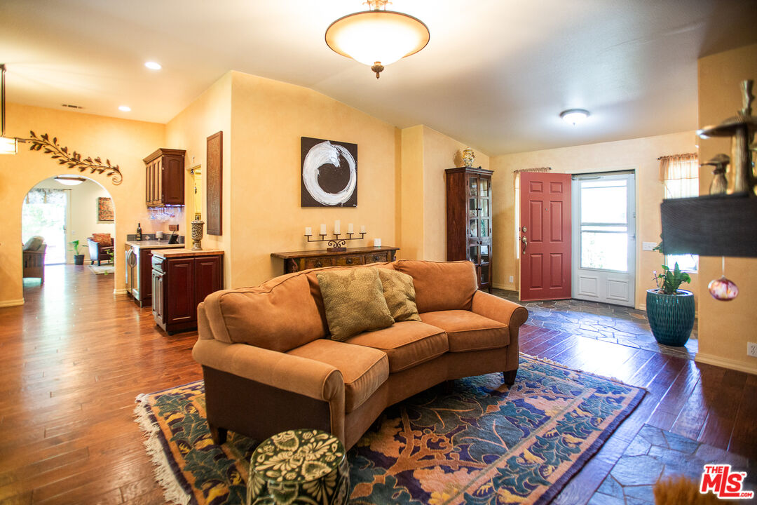 969 Vintage Way Los Alamos, CA 93440 - Photo 5 of 59 a living room with furniture and wooden floor