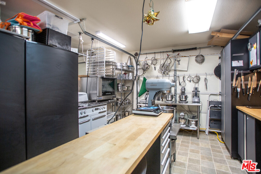 969 Vintage Way Los Alamos, CA 93440 - Photo 57 of 59 a kitchen with refrigerator and cabinets