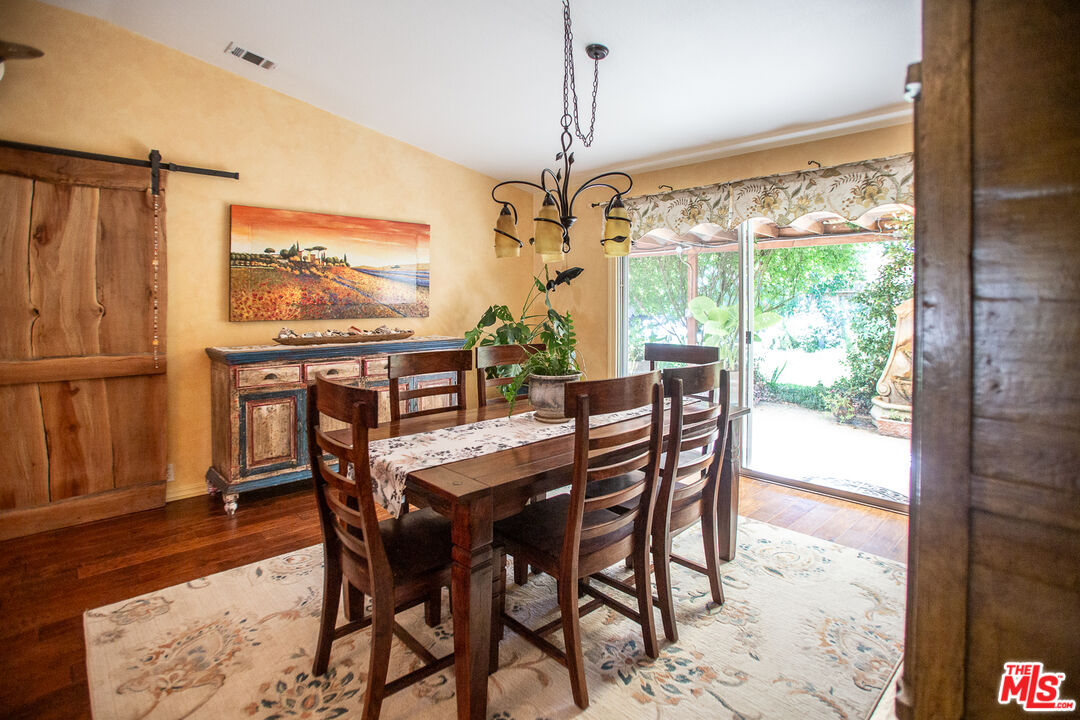 969 Vintage Way Los Alamos, CA 93440 - Photo 7 of 59 a dining room with furniture a chandelier and wooden floor