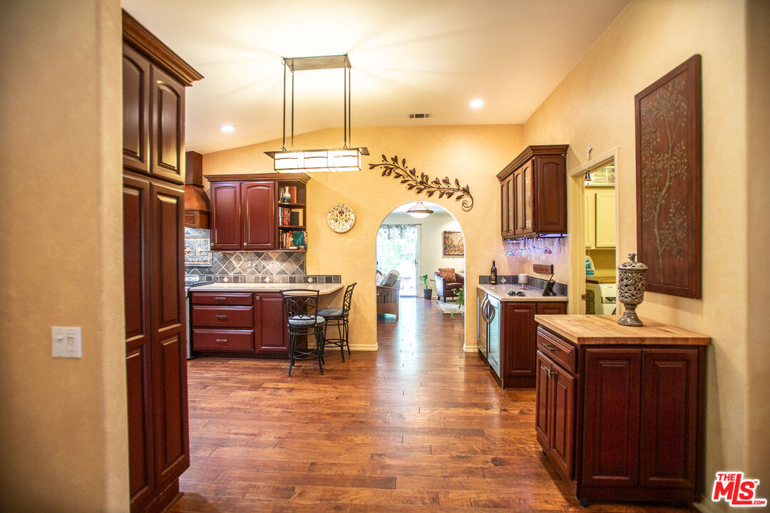969 Vintage Way Los Alamos, CA 93440 - Photo 10 of 59 a large room with lots of counter space and chandelier