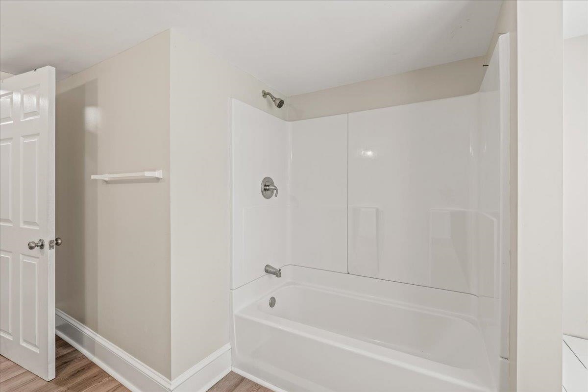 544 Battlefield Road Fort Defiance, VA 24437 - Photo 21 of 35 a white bath tub sitting next to a shower
