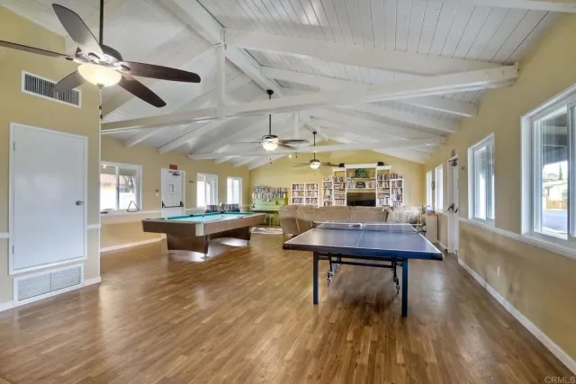 a room with lots of furniture and a wooden floor