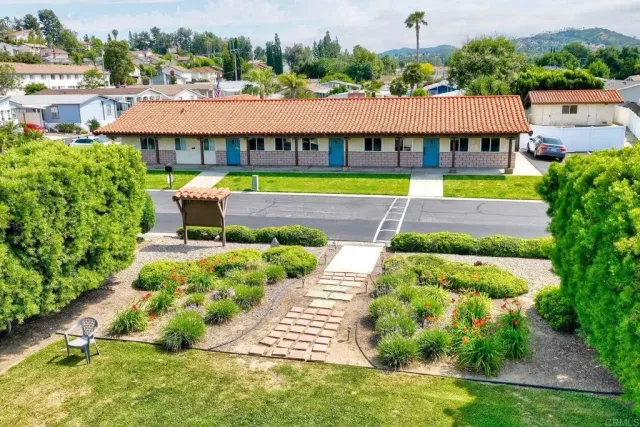 an aerial view of a swimming pool and outdoor space