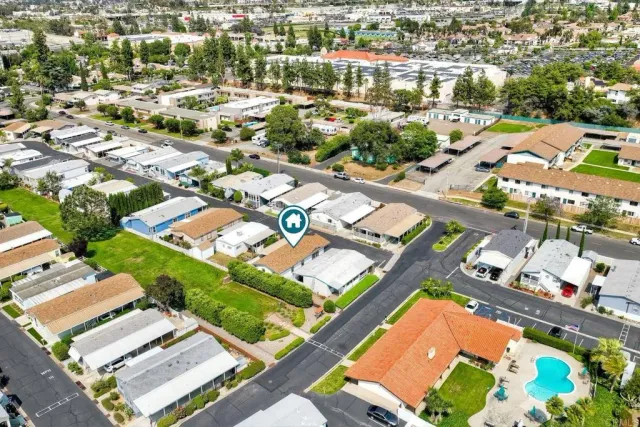 an aerial view of residential houses with outdoor space