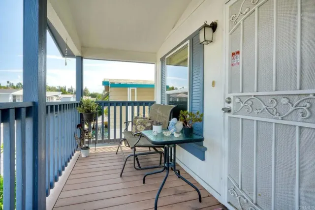 a view of a hallway with furniture and front door
