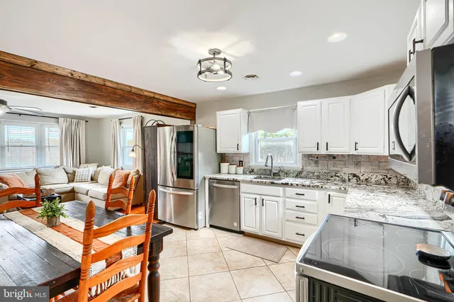 a view of a swimming pool with a yard