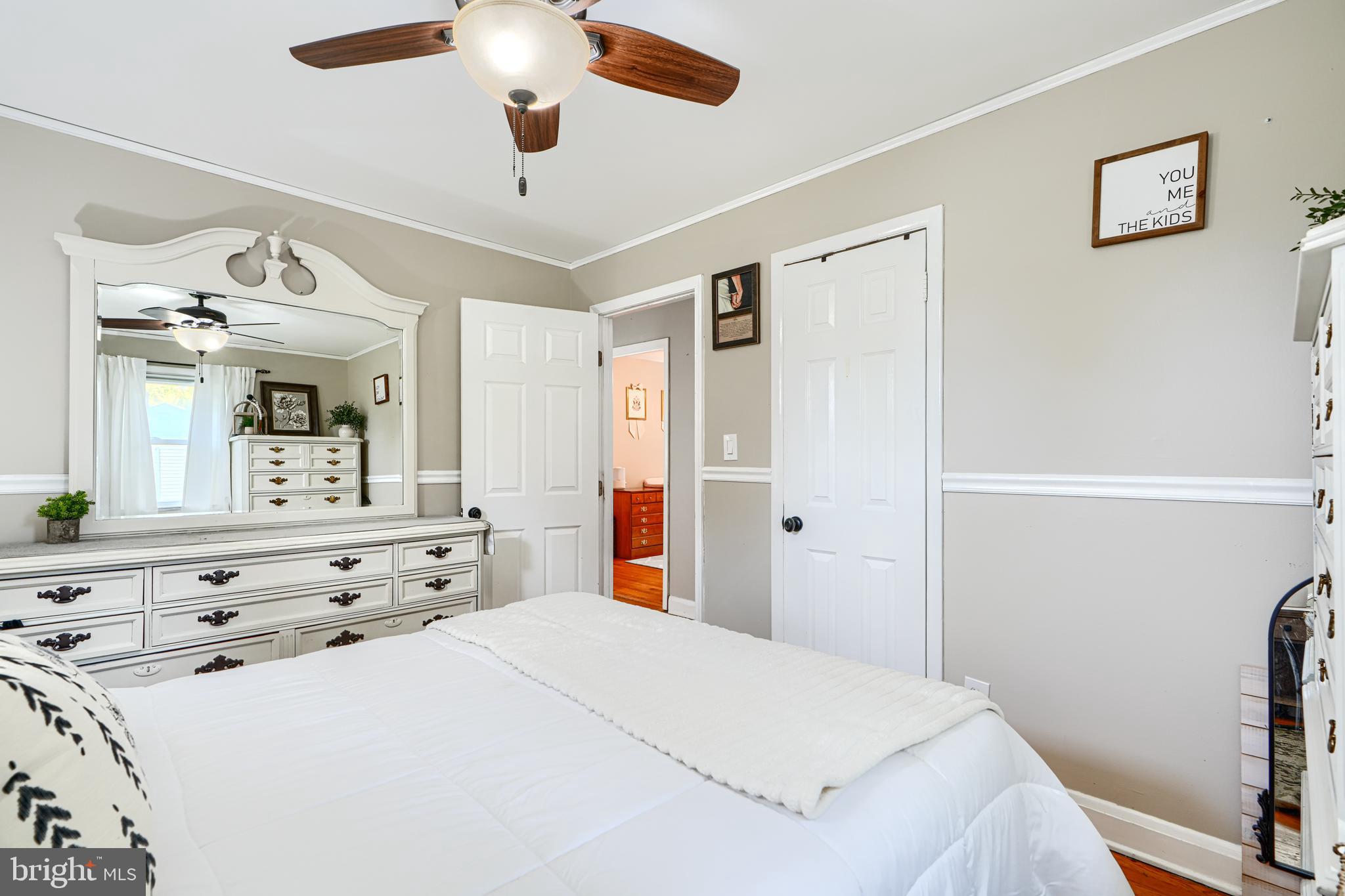 1026 Prospect Mill Road Bel Air, MD 21015 - Photo 13 of 38 a bedroom with a bed and a chandelier