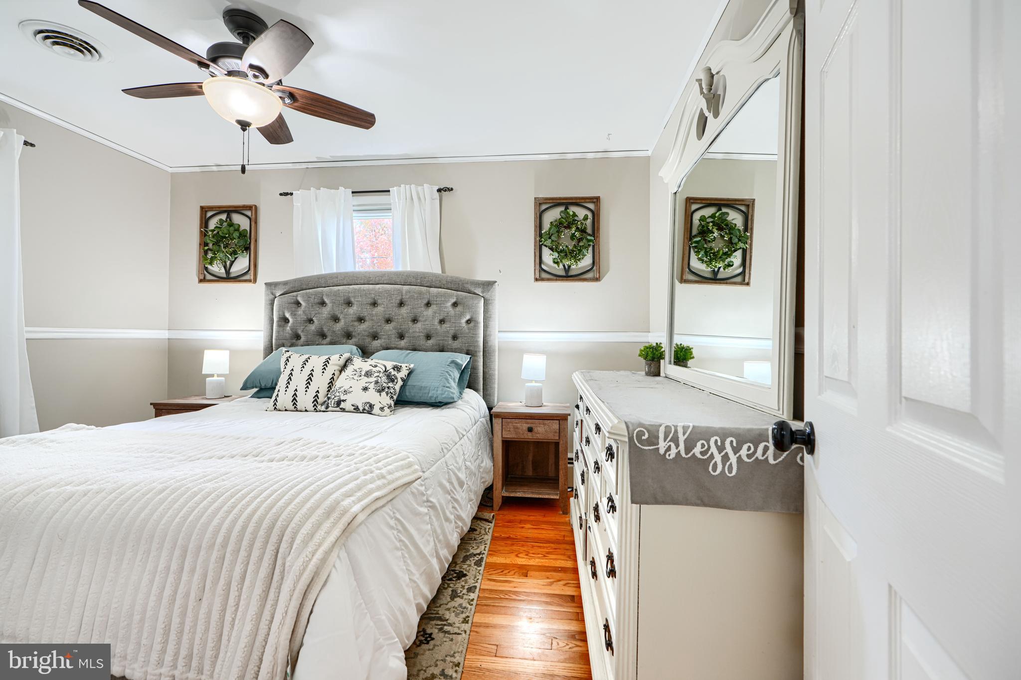 1026 Prospect Mill Road Bel Air, MD 21015 - Photo 14 of 38 a bedroom with a bed and a chandelier