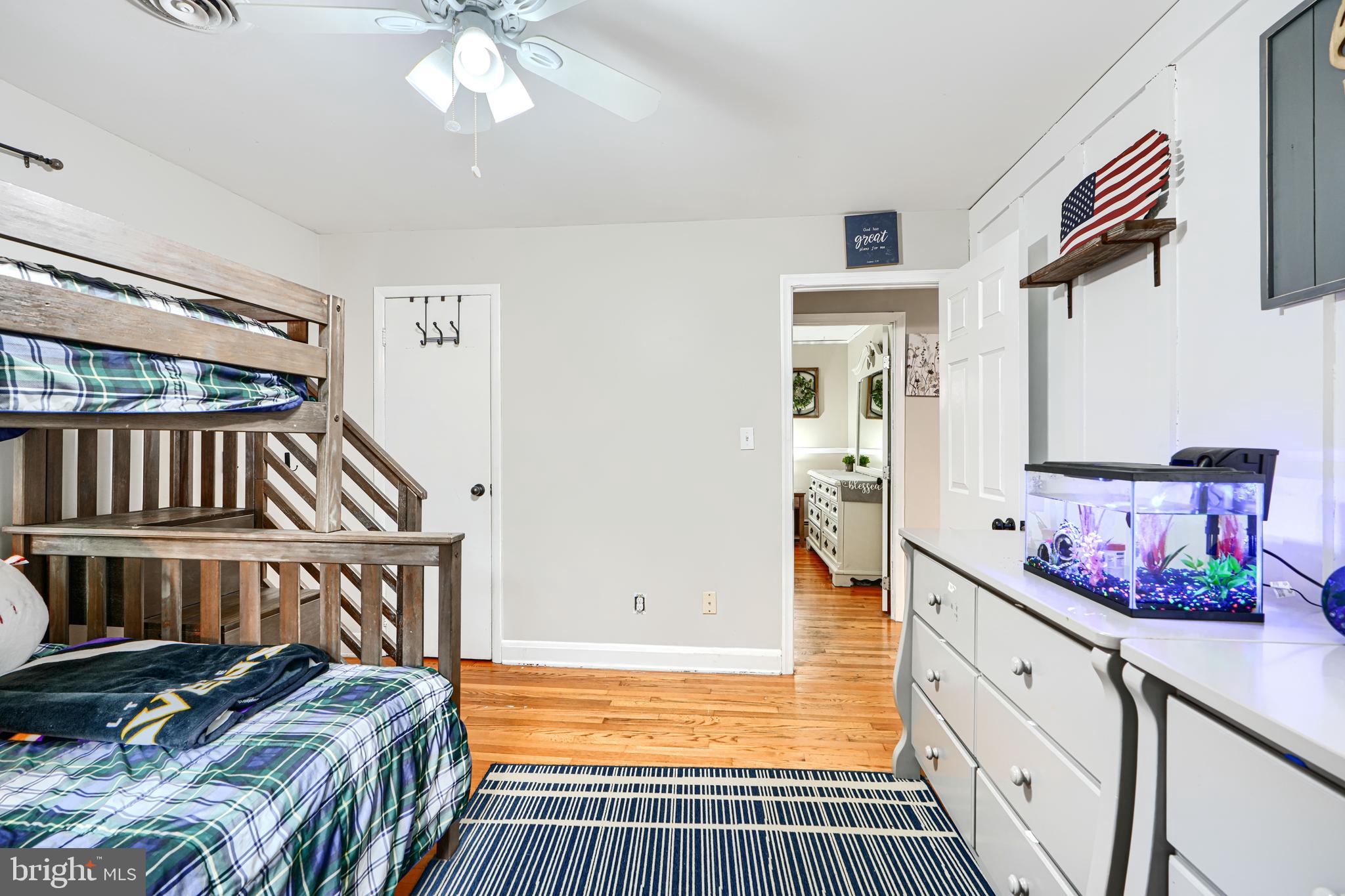 1026 Prospect Mill Road Bel Air, MD 21015 - Photo 16 of 38 a spacious bedroom with a bed and wooden floor