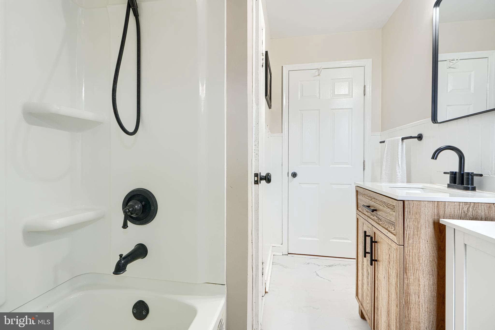1026 Prospect Mill Road Bel Air, MD 21015 - Photo 20 of 38 a bathroom with a granite countertop sink a mirror and shower