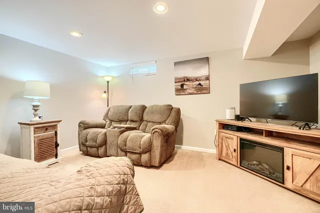 a view of room with window and furniture