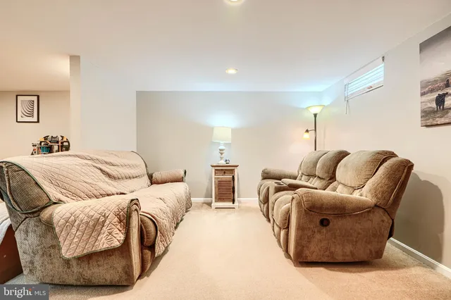 a living room with a flat screen tv and a fireplace