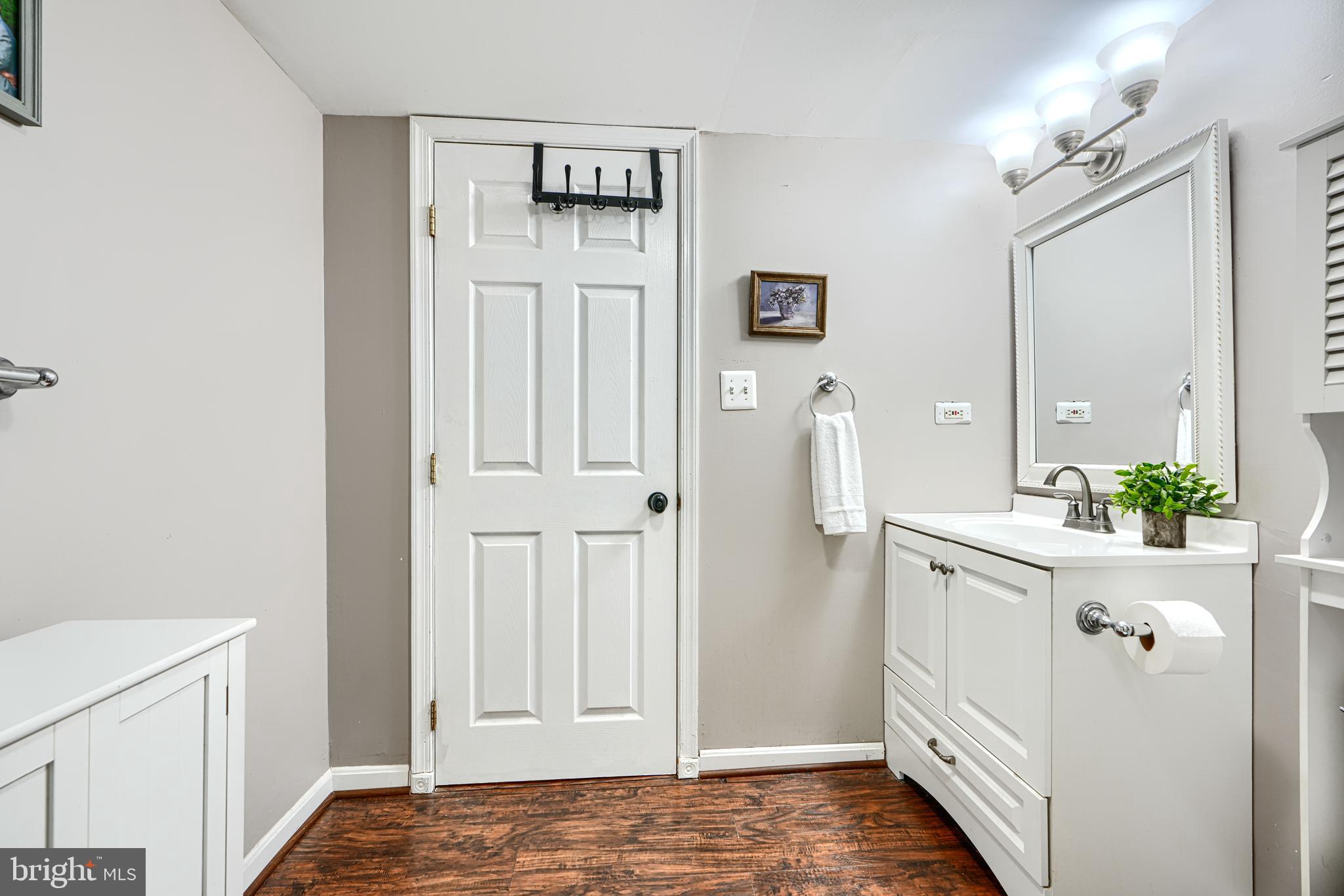 1026 Prospect Mill Road Bel Air, MD 21015 - Photo 28 of 38 a bathroom with a sink a mirror and a shower