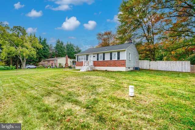 a house view with a sitting space and garden