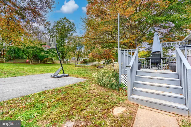 a view of a patio with a table chairs and a table
