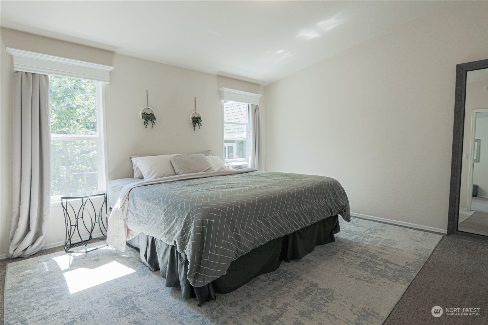 20426 32nd Drive Southeast Bothell, WA 98012 - Photo 11 of 23 a large bed sitting in a bedroom next to a window