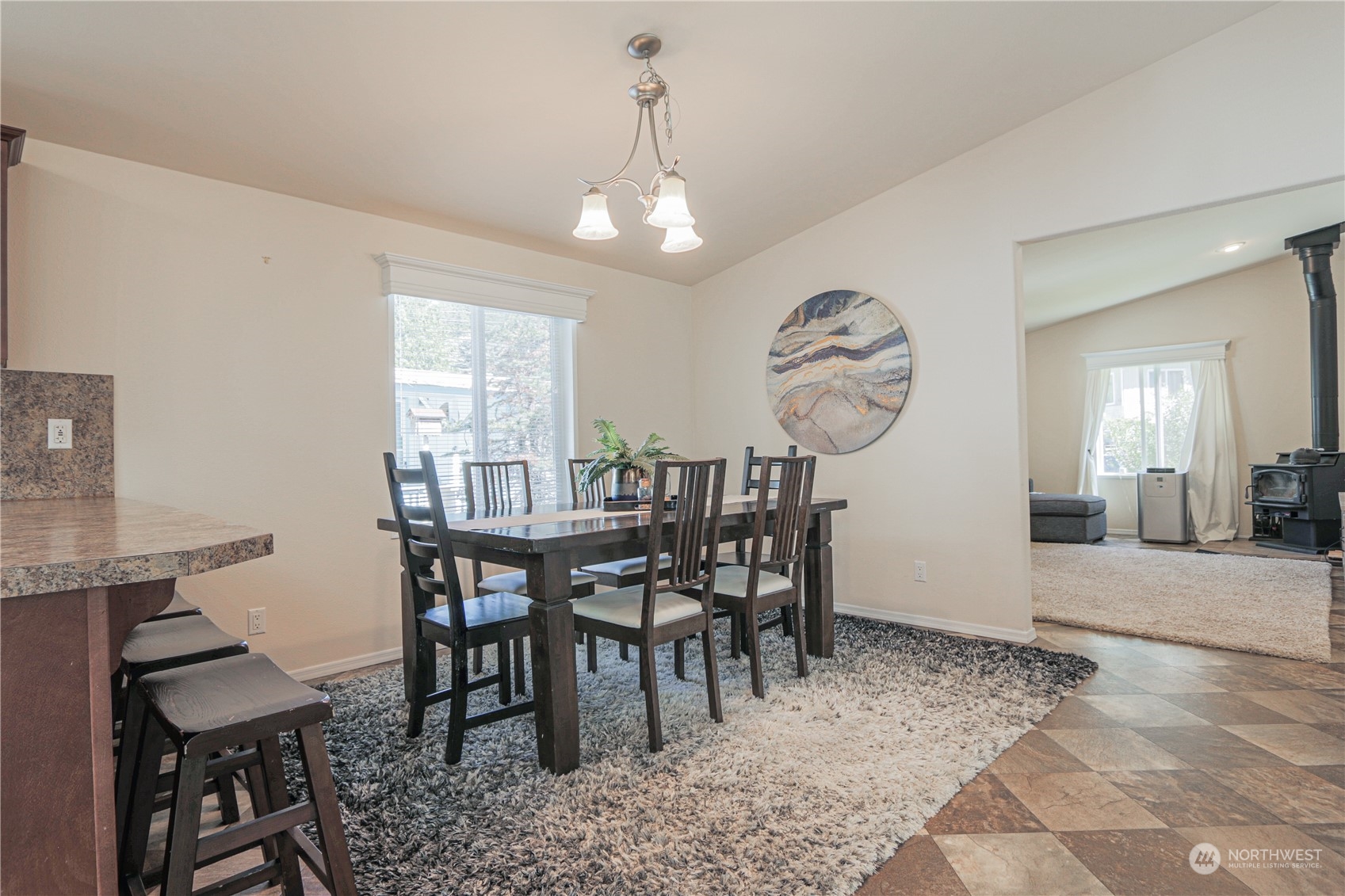 20426 32nd Drive Southeast Bothell, WA 98012 - Photo 6 of 23 a view of a dining room with furniture and a chandelier