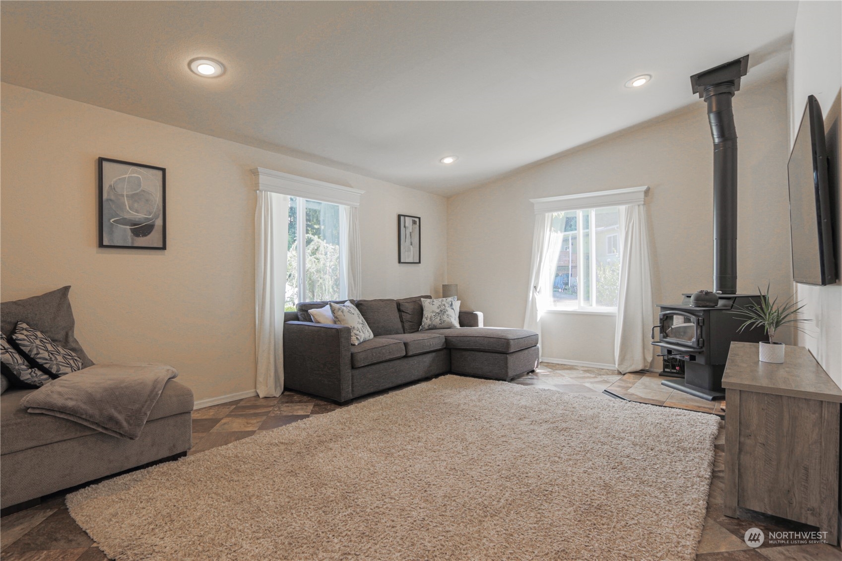 20426 32nd Drive Southeast Bothell, WA 98012 - Photo 7 of 23 a living room with furniture and a flat screen tv