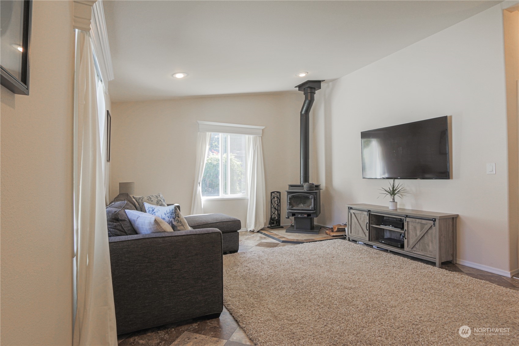 20426 32nd Drive Southeast Bothell, WA 98012 - Photo 8 of 23 a living room with furniture and a flat screen tv