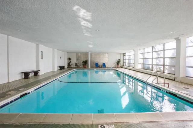 a view of a kitchen with kitchen island and a large window