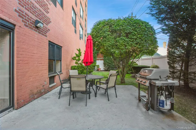 a view of a chairs and table in a patio