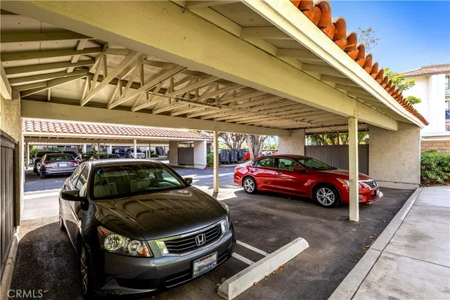 a view of parking garage with cars parked