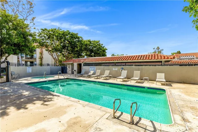 a front view of house with yard seating and green space