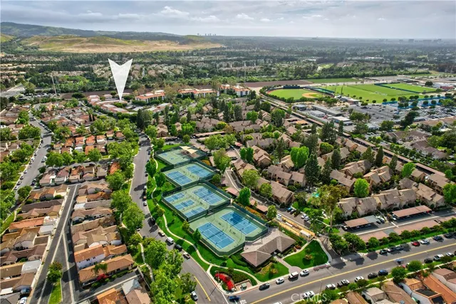 an aerial view of residential houses with outdoor space
