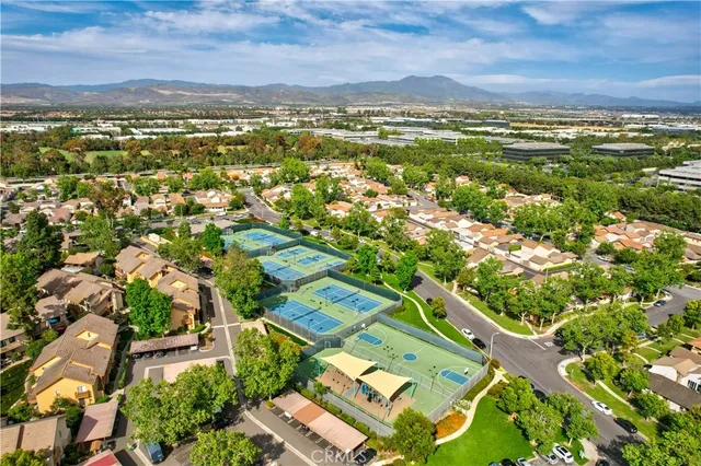 an aerial view of residential houses with outdoor space