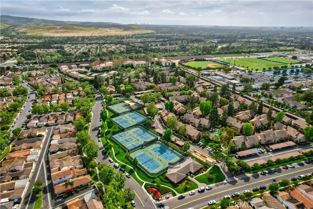 an aerial view of residential houses with outdoor space