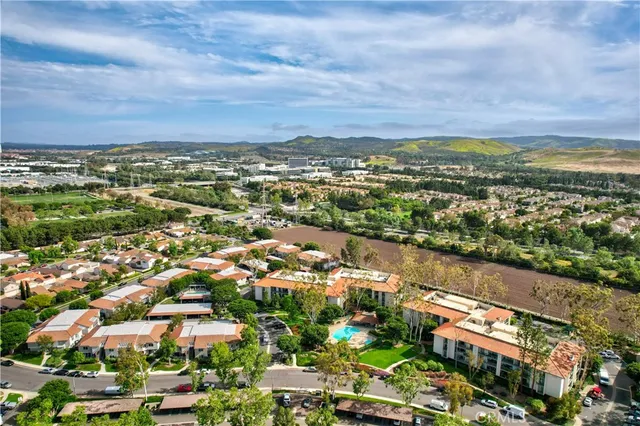 an aerial view of residential building and car parked