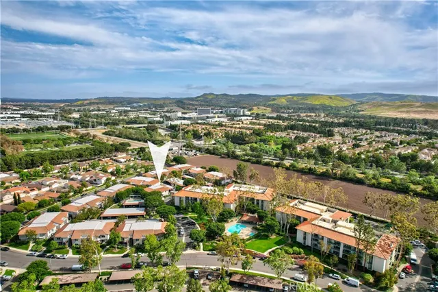 an aerial view of city and lake