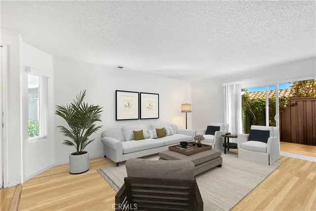 a bedroom with furniture and a potted plant