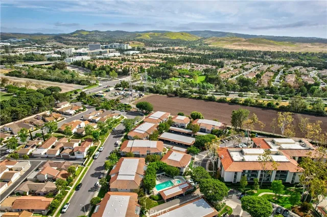 an aerial view of residential houses with outdoor space