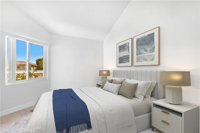 a bedroom with a bed and lamps