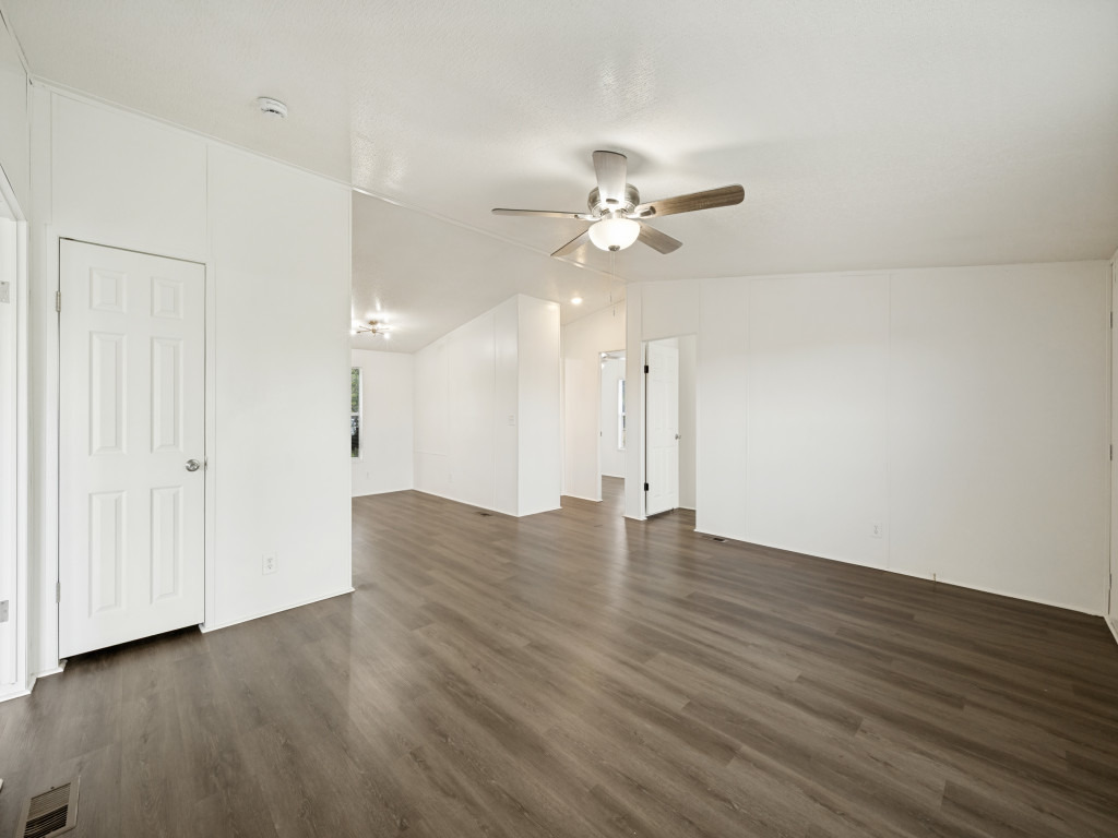 4654 Old Howard Road Temple, TX 76504 - Photo 5 of 25 Clean lines and modern flooring define this spacious, naturally illuminated room, ready for your personal touch.