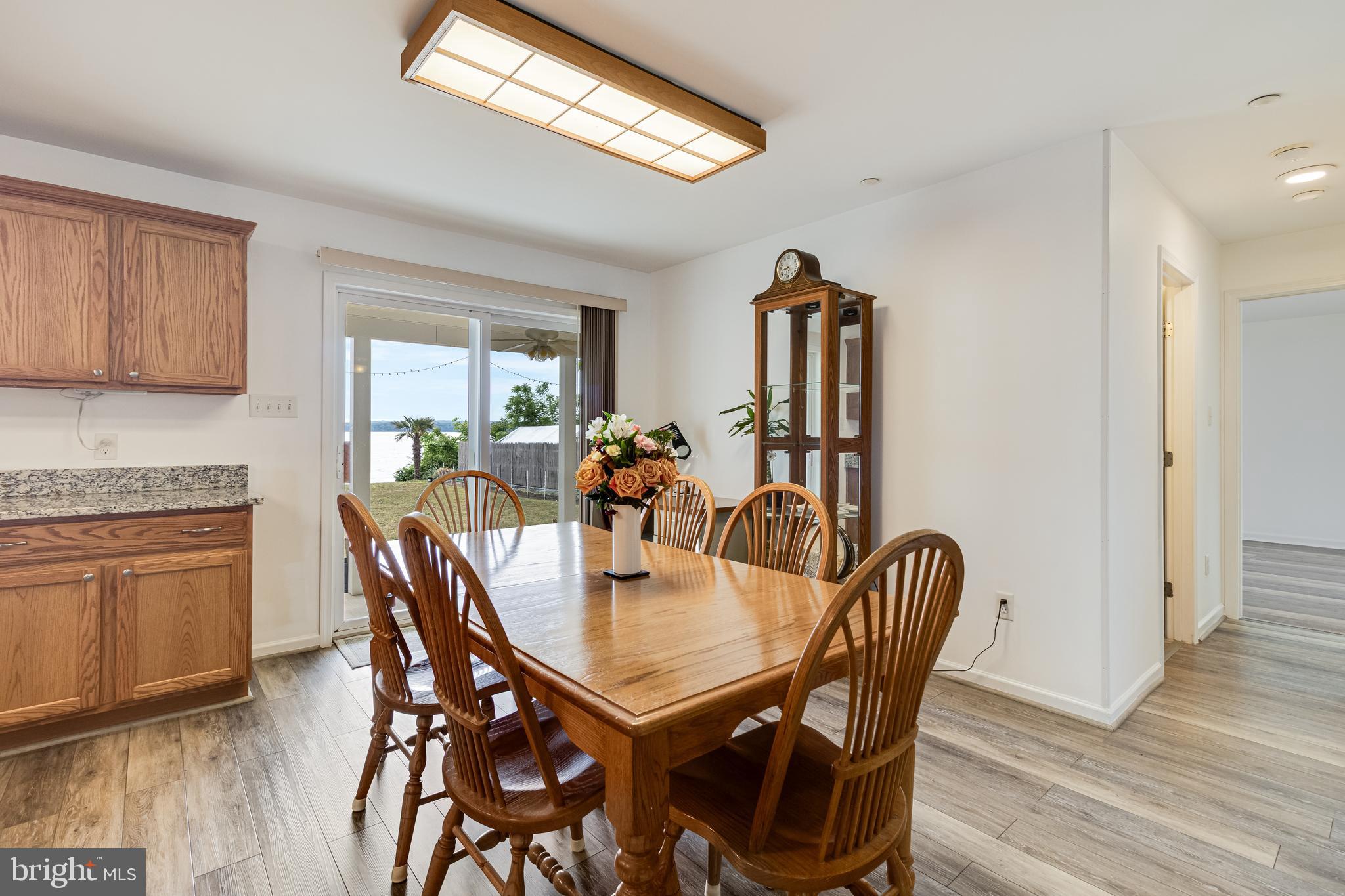 12015 Woodbury Road Nanjemoy, MD 20662 - Photo 31 of 53 a view of a dining room with furniture and wooden floor