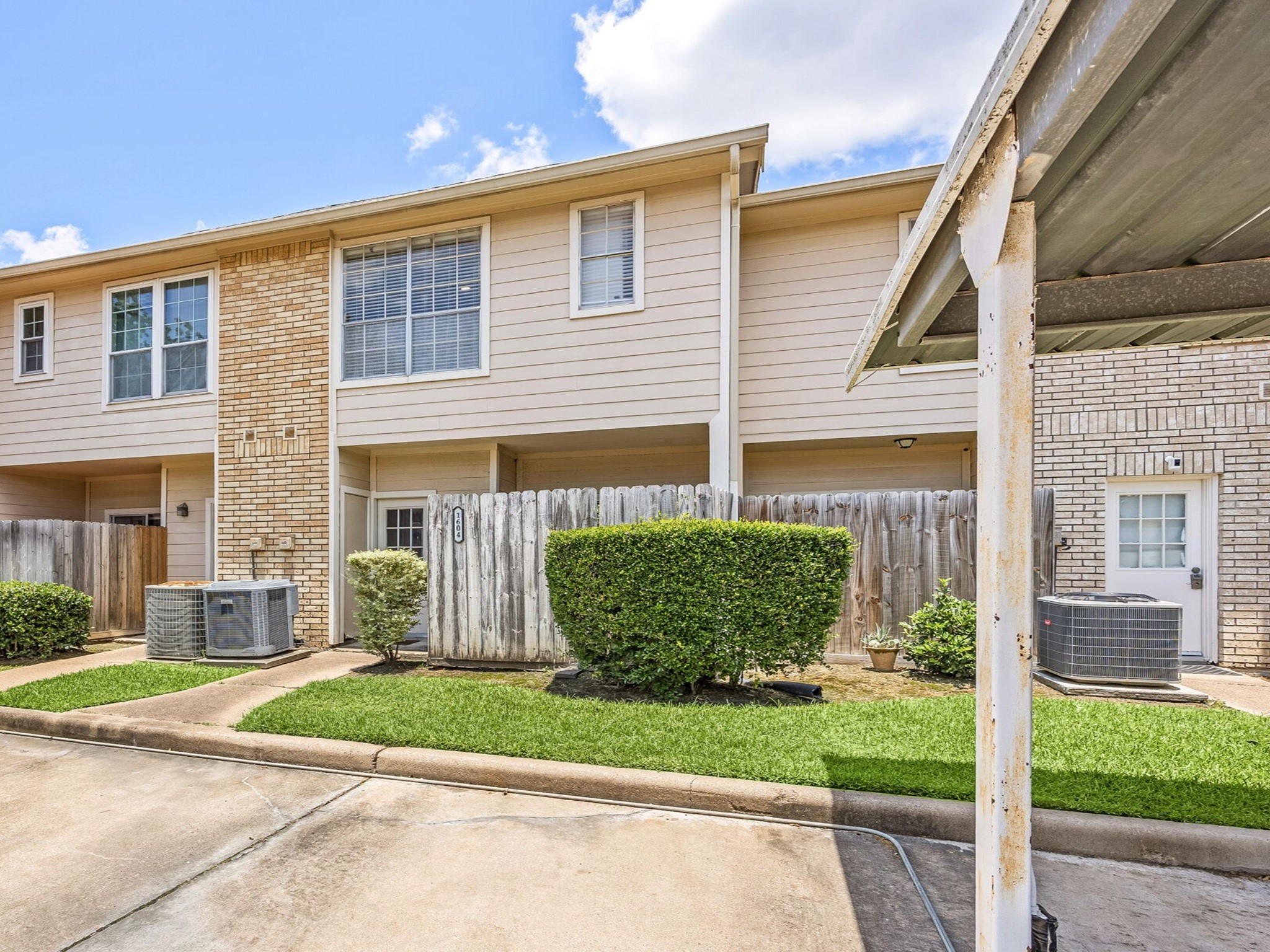 7575 Cambridge Street, Unit 1604 Houston, TX 77054 - Photo 22 of 26 a front view of a house with a yard