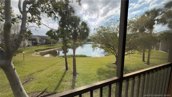 a view of swimming pool from a balcony