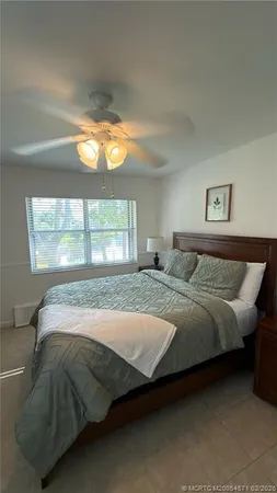 a bedroom with a bed and window