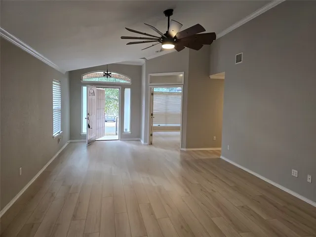 a view of an empty room with a window