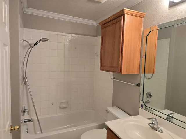 a bathroom with a shower curtain and a sink
