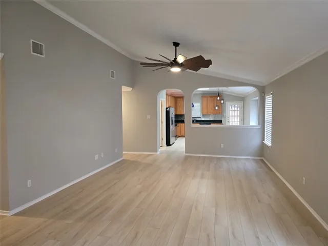 a view of a kitchen with a dishwasher cabinets and wooden floor