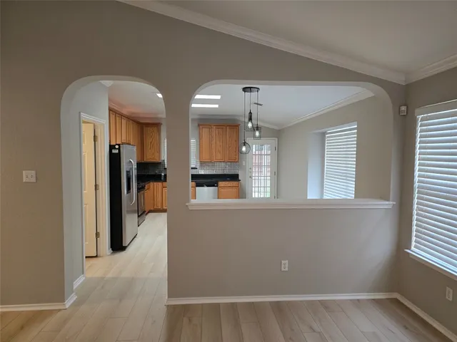 a view of a kitchen and a window
