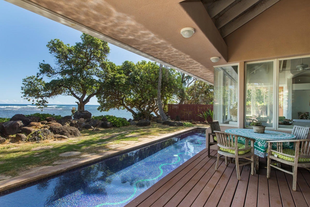 a view of a chairs and table in the patio